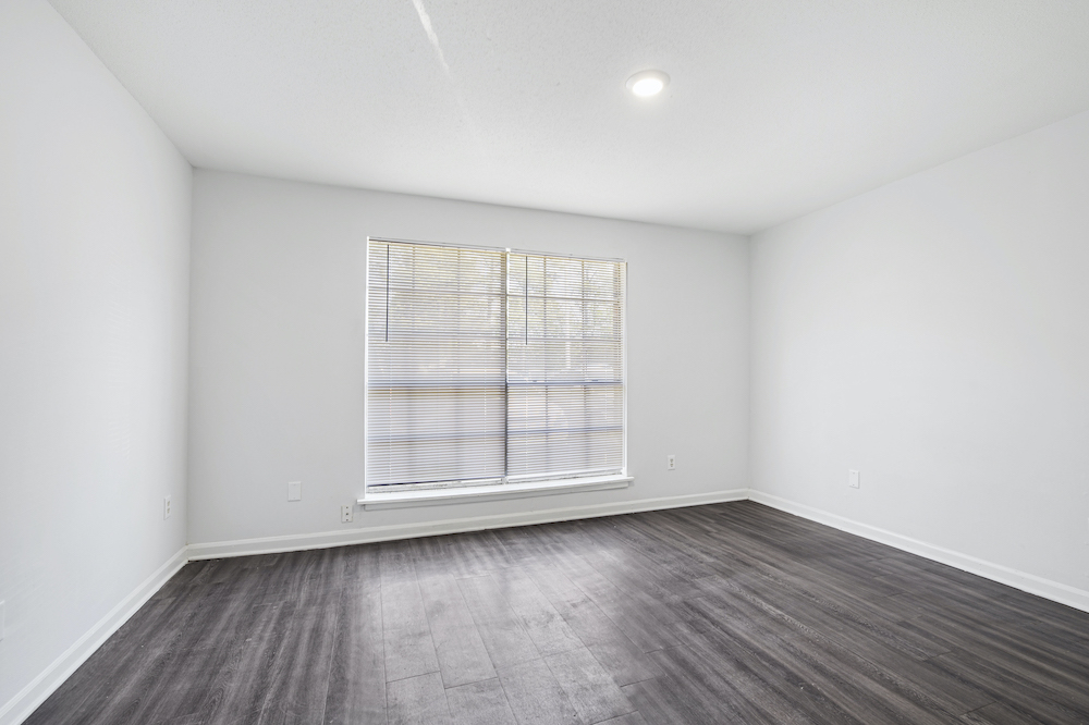 unfurnished bedroom with large window