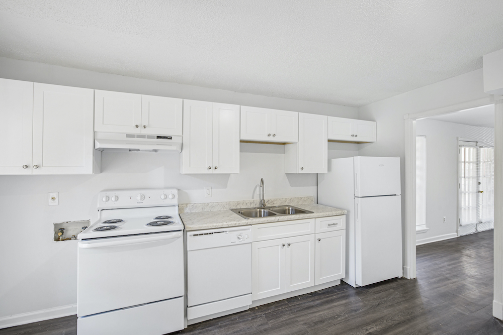 kitchen with white appliances and cabinets