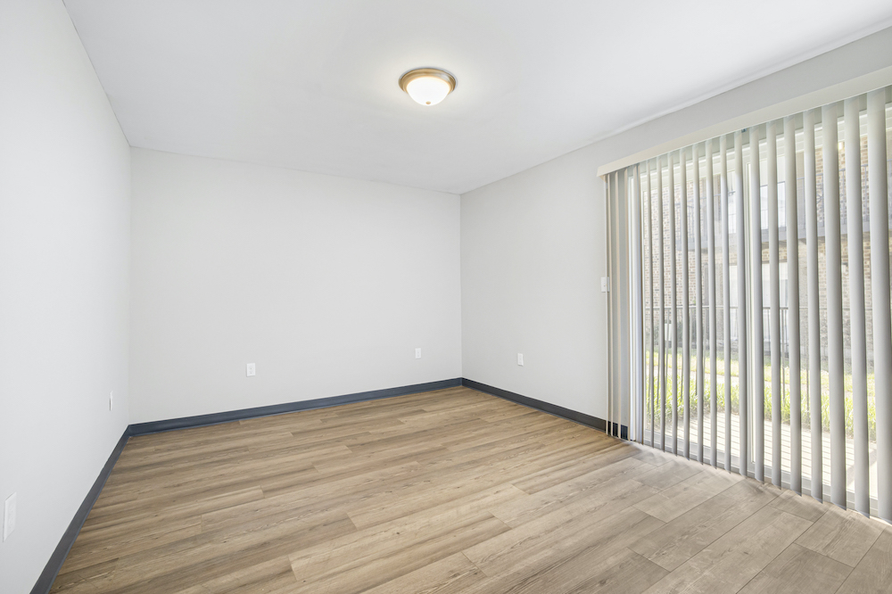 unfurnished room with sliding glass door
