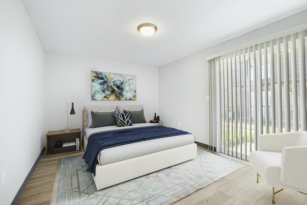 furnished bedroom with sliding glass door